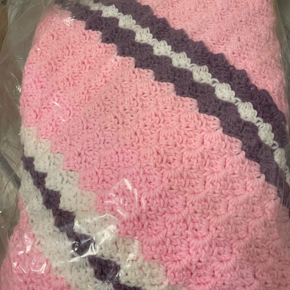 Pink and purple crochet blanket with matching pacifiers